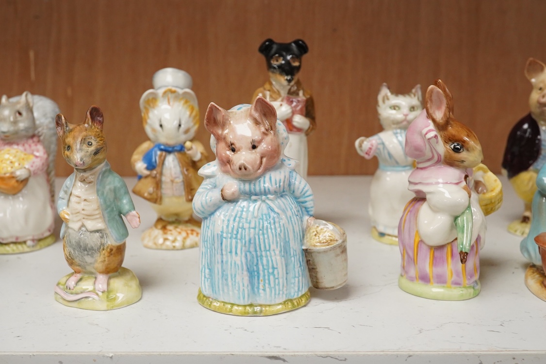 A collection of thirteen Beatrix Potter character figures, stamped with a gold stamp F Warn and Co Ltd, Beswick England, largest 12cm high